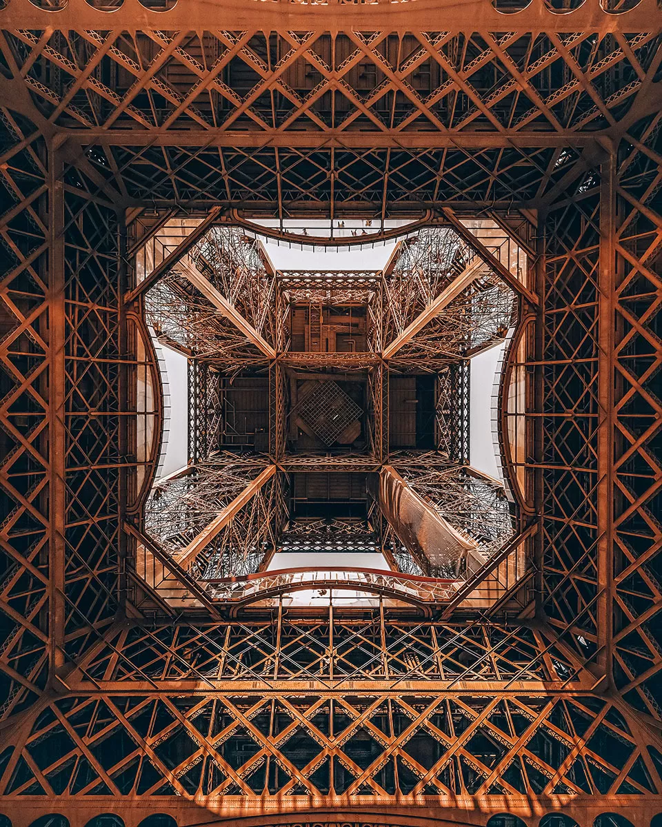When was the Eiffel Tower Built and Why - Looking up through the centre of the Eiffel Tower