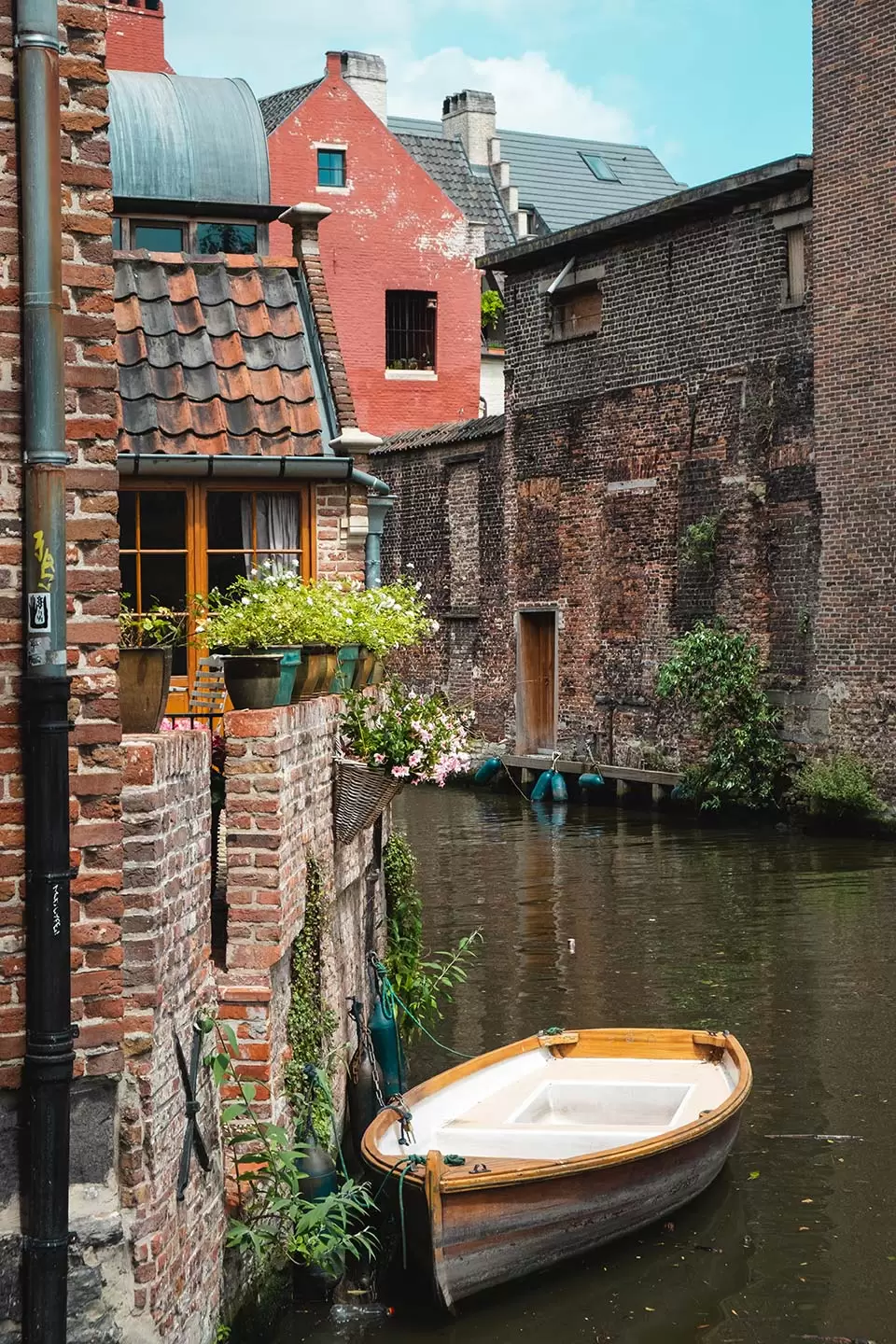 Ghent day trip itinerary - Things to See-in Ghent in One Day Itinerary - Canal and boat in Patershol