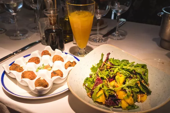 Best things to do in Costa Brava - Platja d'Aro where to eat casa brinda mando salad and croquettes