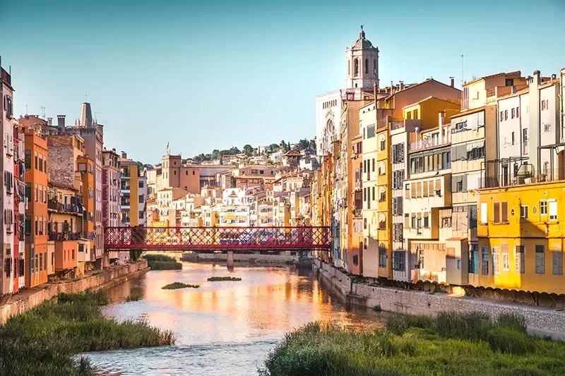 Best things to do in Costa Brava - girona coloured houses and eiffel bridge