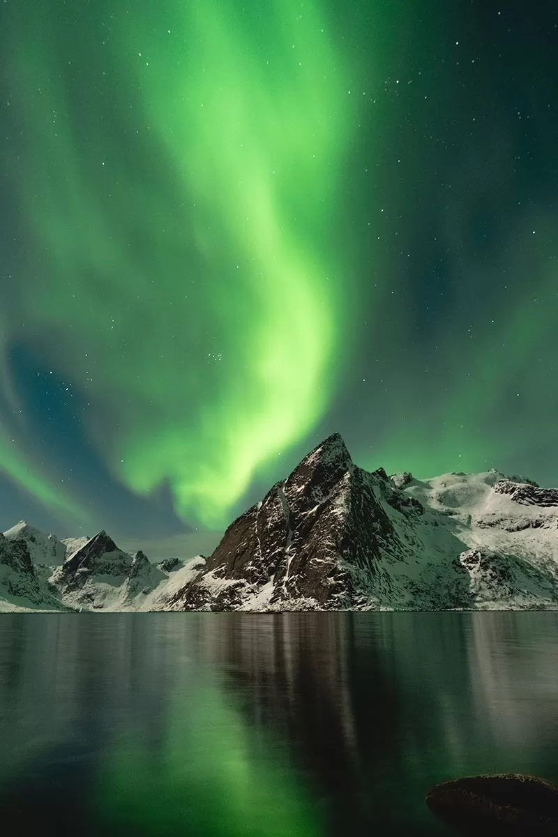 Where to stay Lofoten accommodation - Northern Lights above mountain