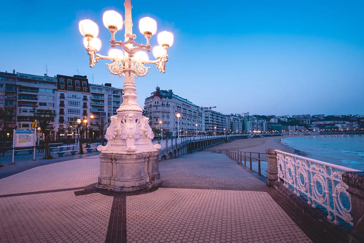 Top things to do in San Sebastian Spain - Promenade and Street lamp at sunrise