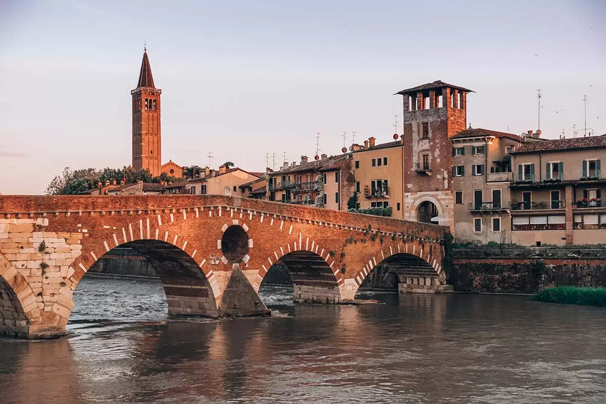 Best Things to do in Verona Italy - Ponte Pietra at sunset