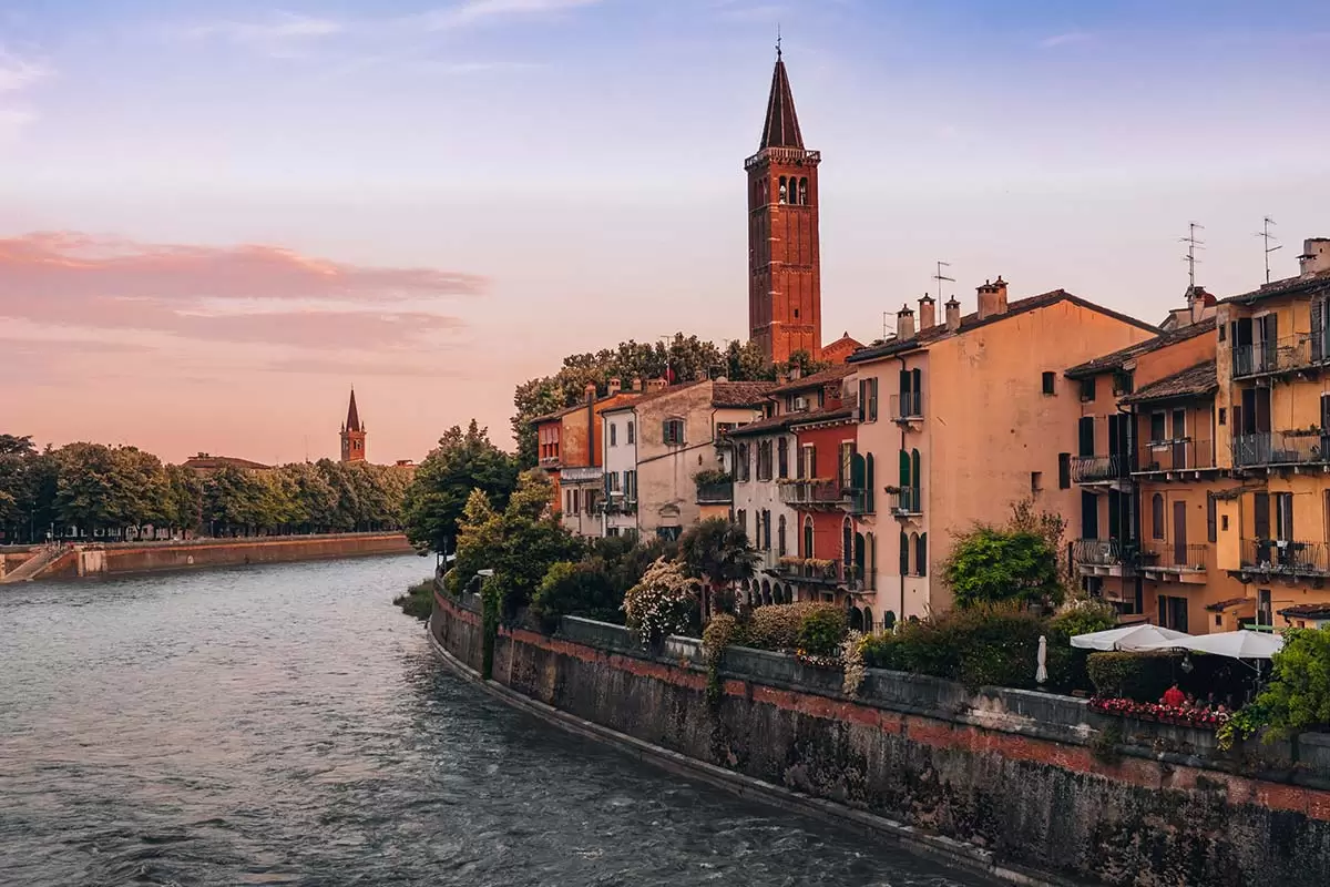 Best Things to do in Verona Italy - Ponte Pietra of River Adige at sunset