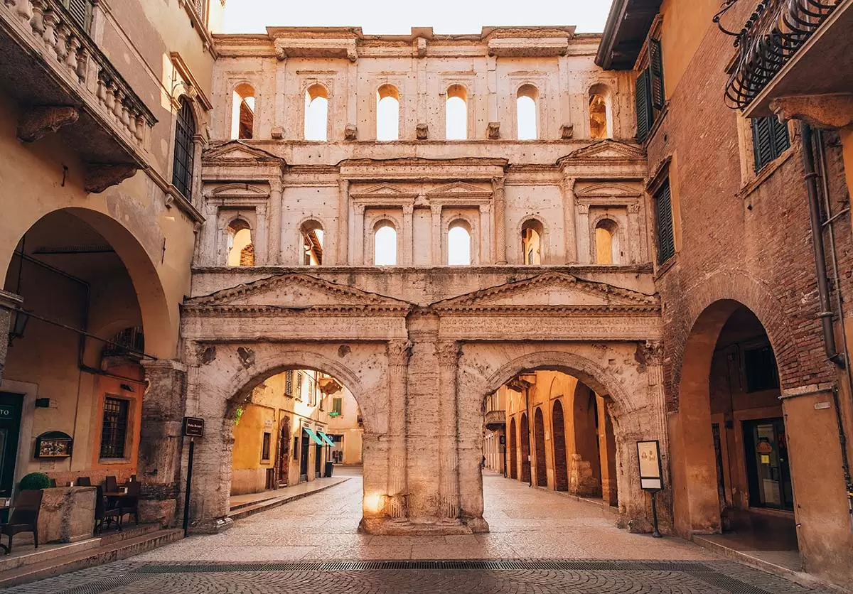 Best Things to do in Verona Italy - Porta Borsari at sunrise