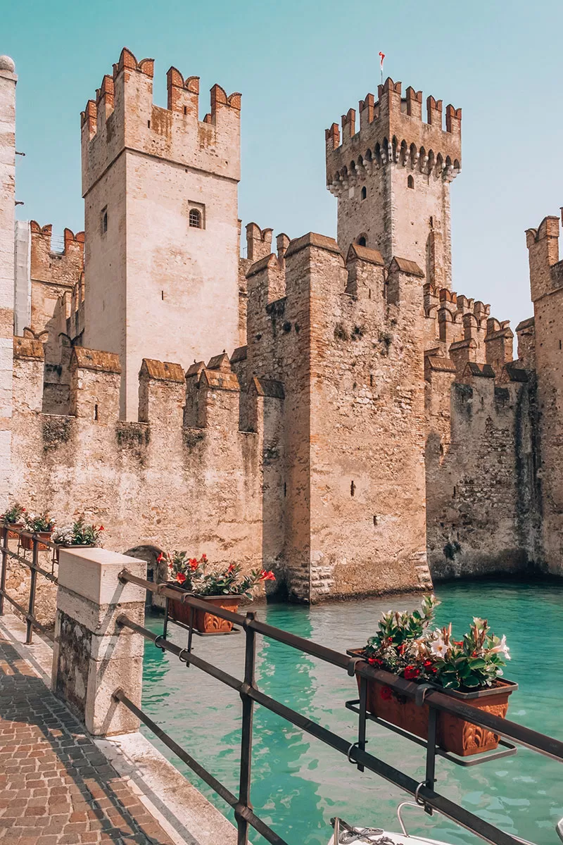Best Things to do in Verona Italy - Scaligero Castle in Sirmione and flowers
