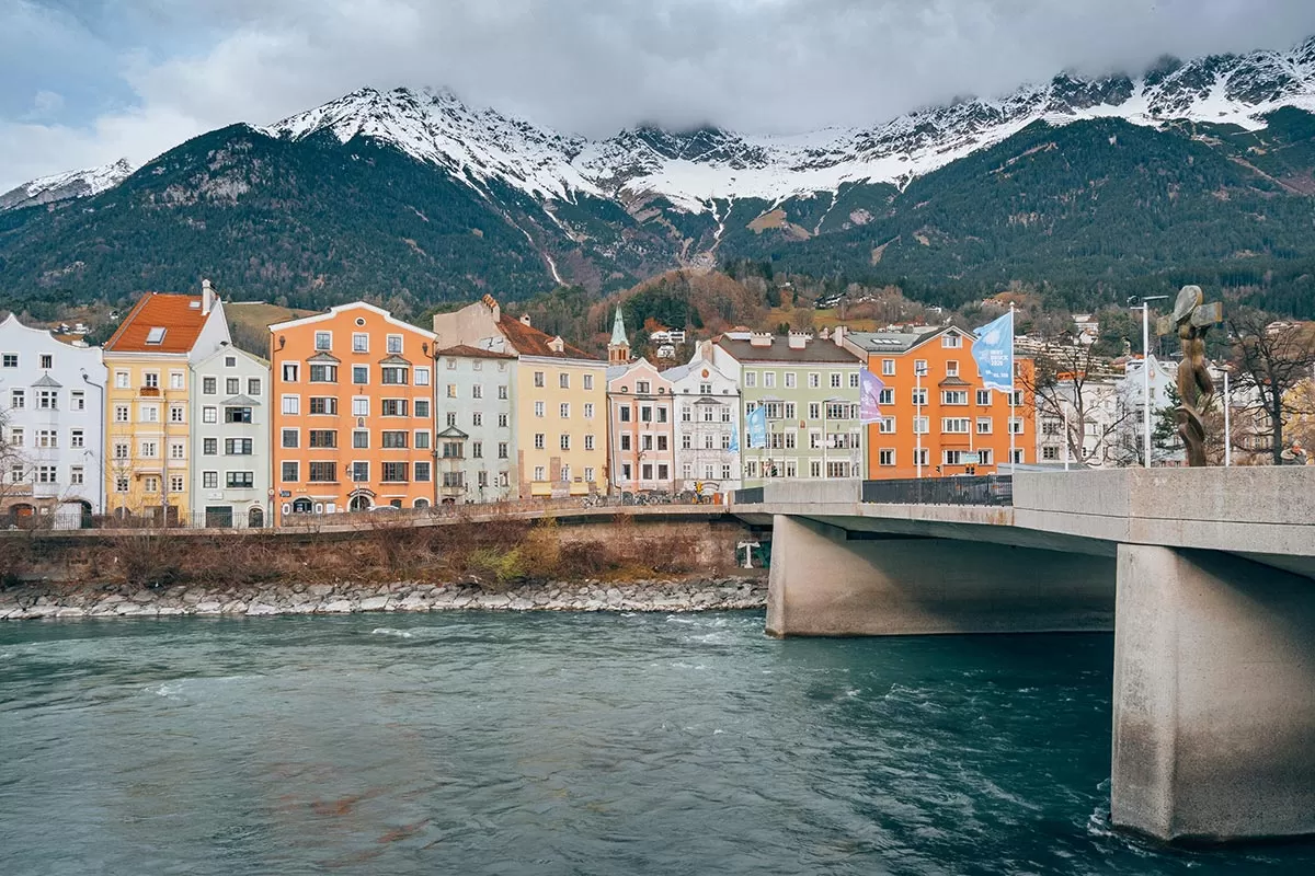 Best things to do in Innsbruck Austria - Innbrucke Bridge Alps Storm Clouds