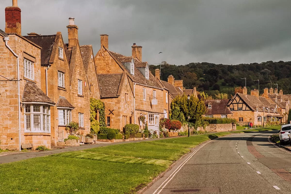 Best Things to Do in Broadway - The Cotswolds - Jacobean homes on Upper High Street on a sunny day