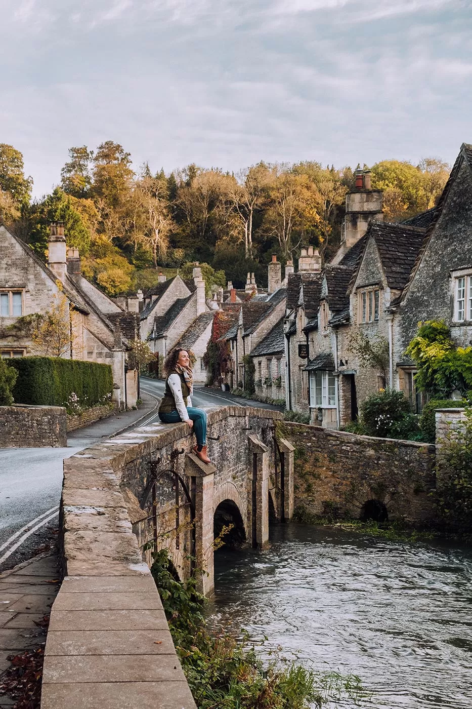 Best Things to Do in Castle Combe - The Cotswolds - Sitting on the bridge at Water Lane near weavers cottages