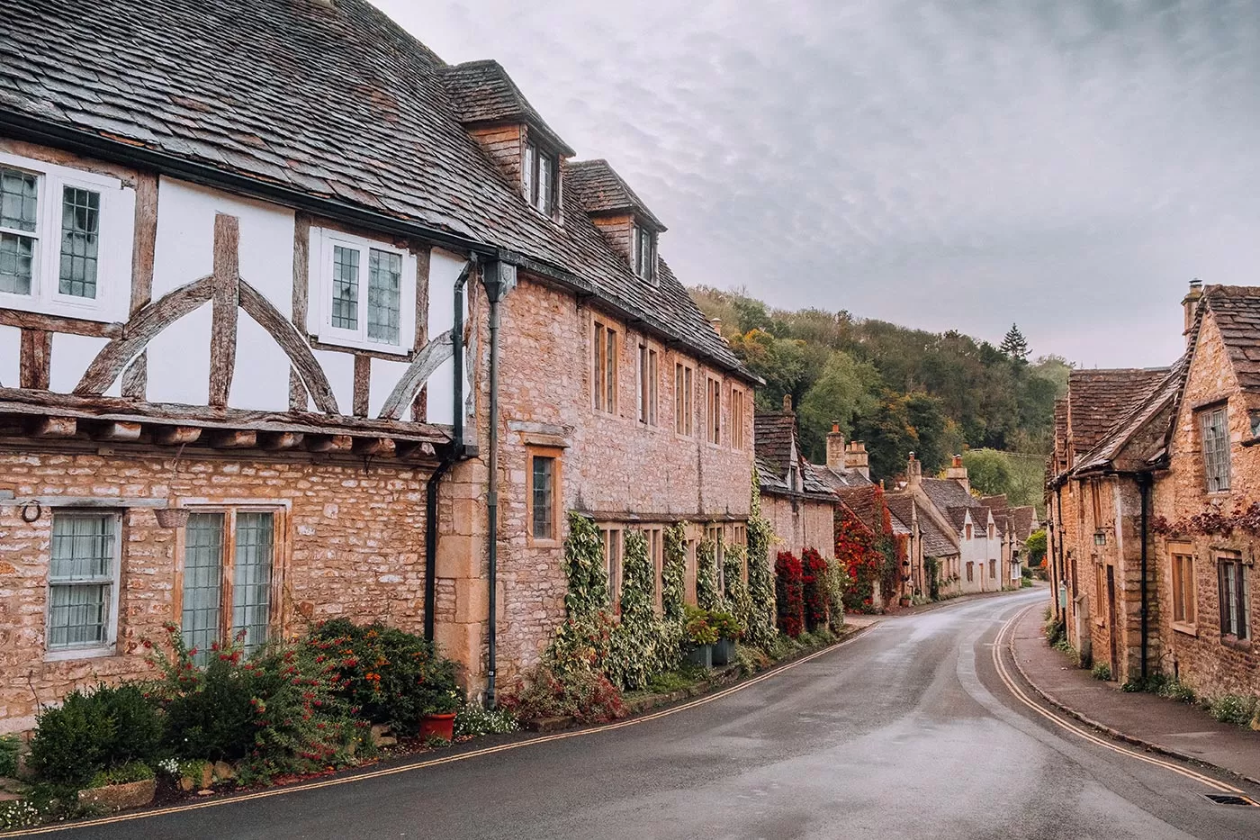 Best Things to Do in Castle Combe - The Cotswolds - View of main street towards bridge
