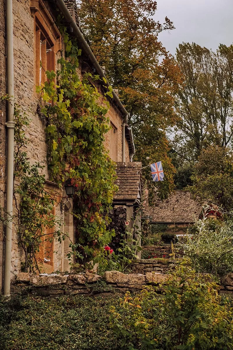 Top things to do in Lower Slaughter -The Cotswolds - Cottage with British flag