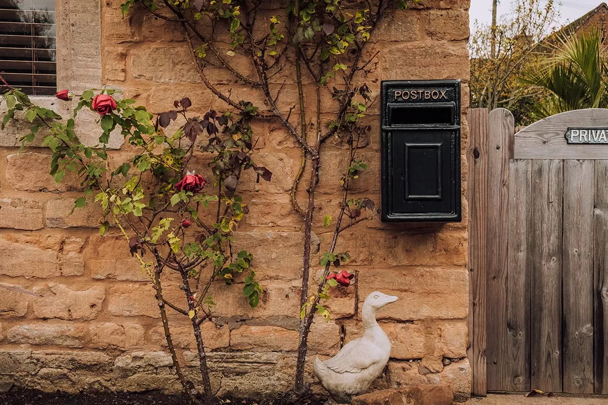 Top things to do in Lower Slaughter -The Cotswolds - Cute mailbox with flowers and duck