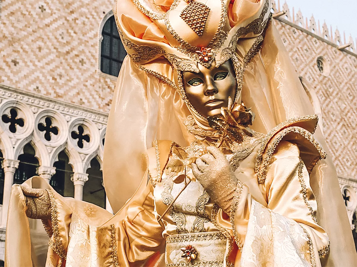 Carnival of Venice, Italy - The Ultimate Guide - Female costume in Piazza San Marco