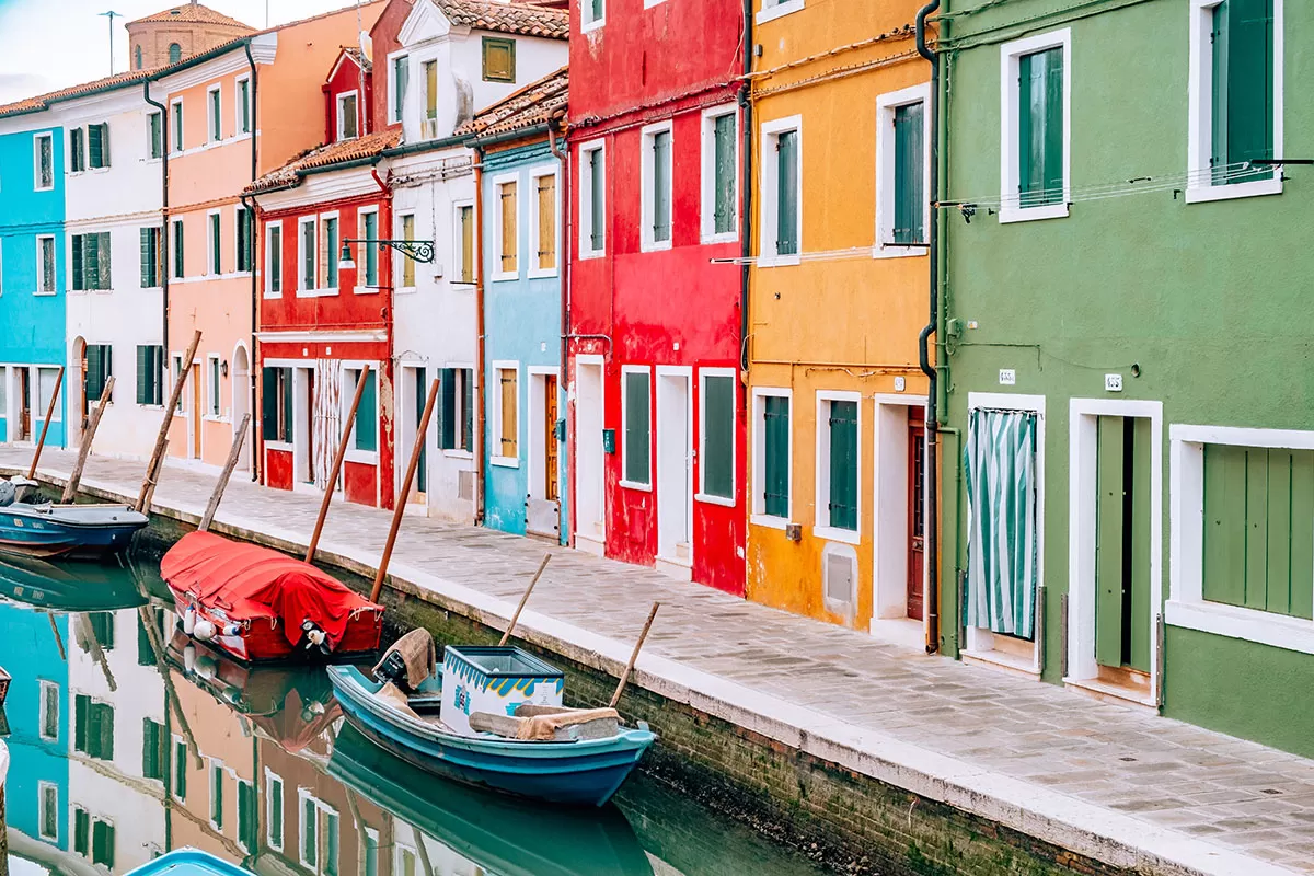 Things to do in Burano Italy - Colourful houses along canal with reflection in water