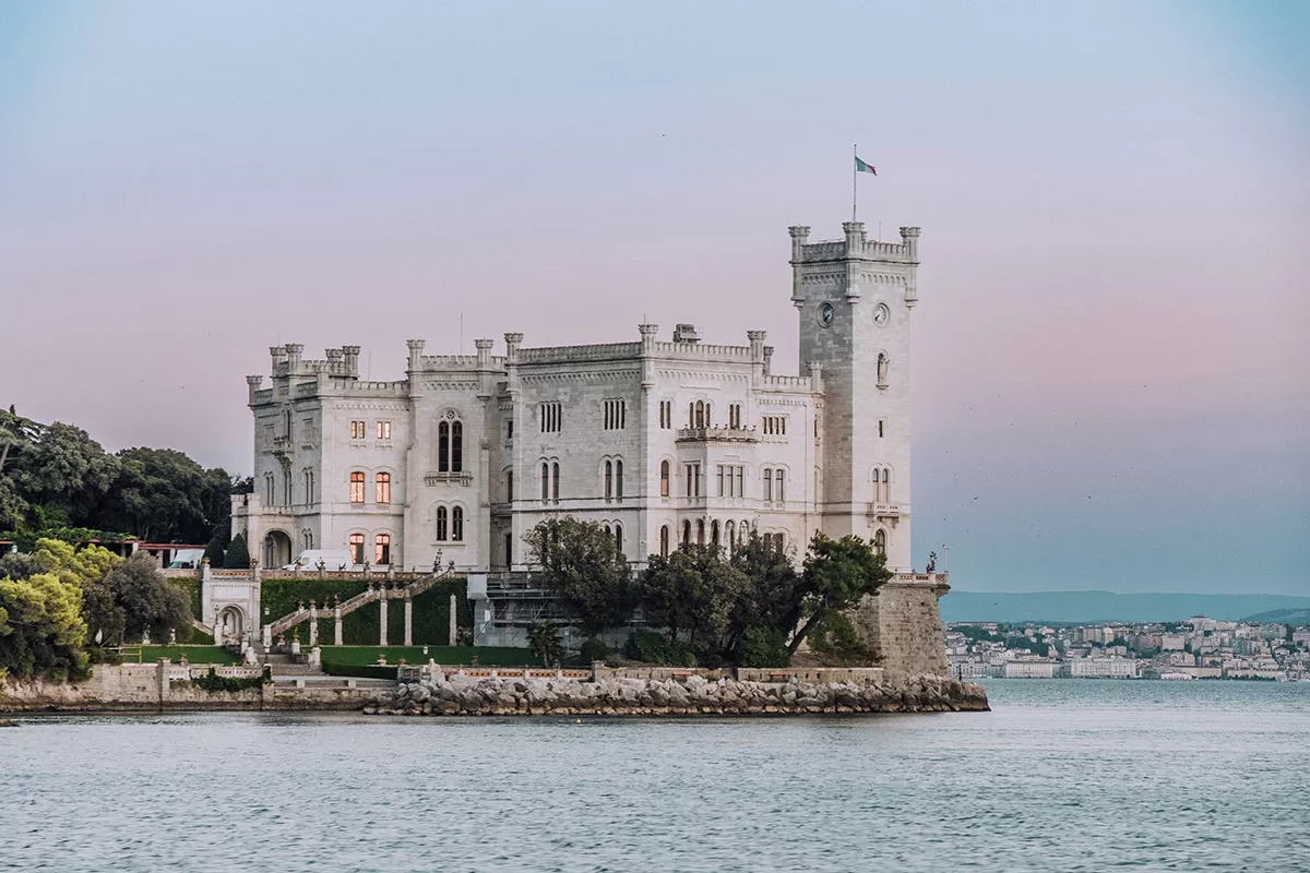 Best Things to Do in Trieste Italy - Miramare Castle at sunset from water