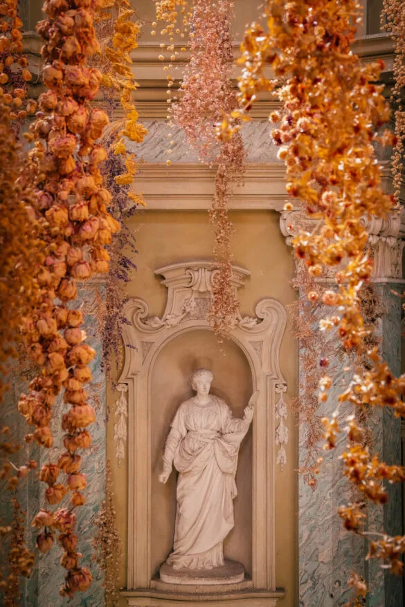 BEST Things to do in Parma Italy - Oratory of San Tiburzio - Oratorio di San Tiburzio - Flowers and statue
