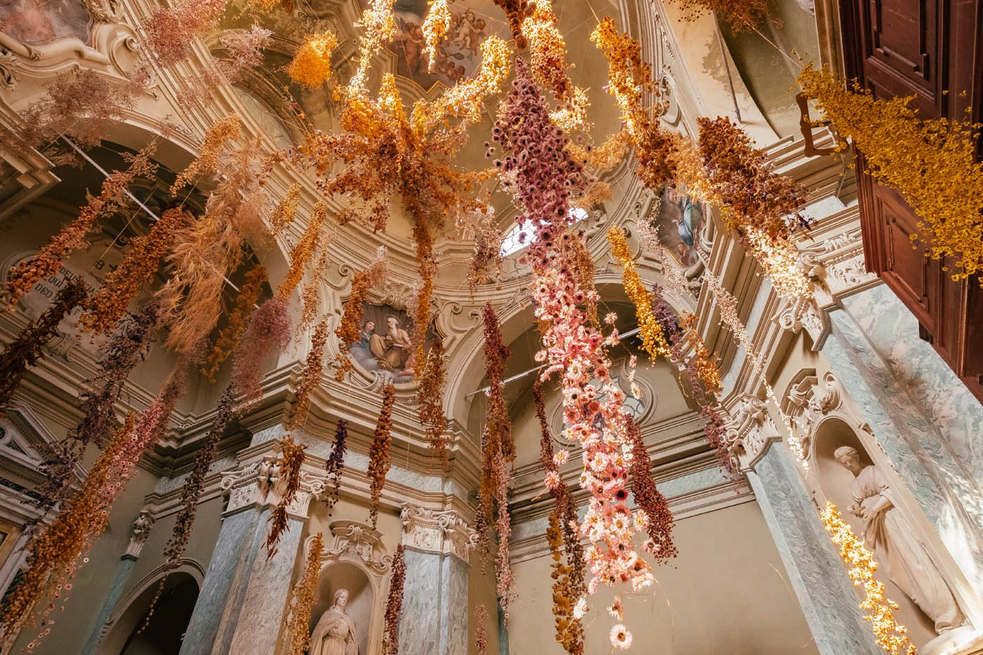 BEST Things to do in Parma Italy - Oratory of San Tiburzio - Oratorio di San Tiburzio - Flowers hanging from ceiling