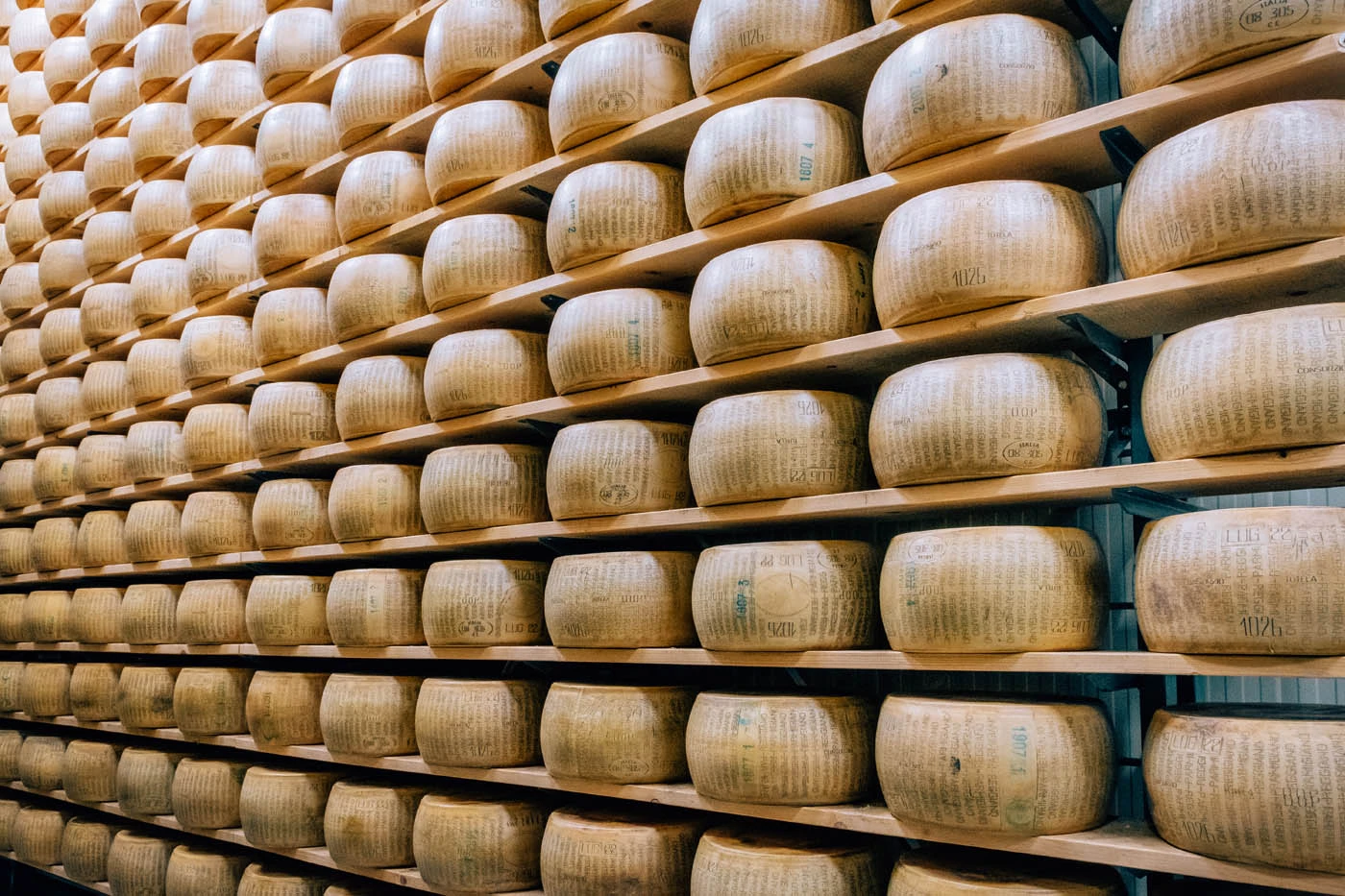 BEST Things to do in Parma Italy - Parmigiano-Reggiano Cheese wheels